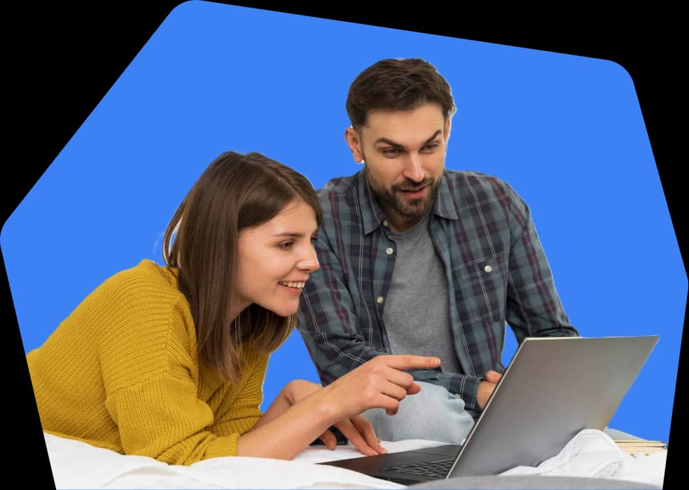 Couple comparing loan options on laptop